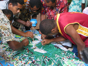 Villagers contributing data to the blank 1:10,000-scale 3D model of Ovalau Island.
